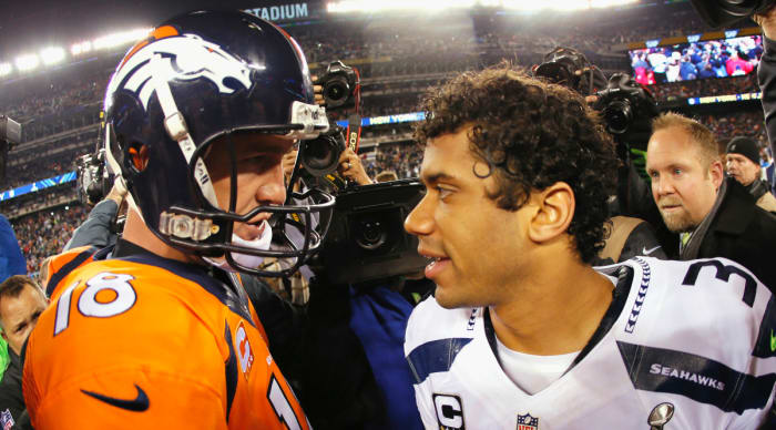 Quarterback Peyton Manning #18 of the Denver Broncos congratulates quarterback Russell Wilson #3 of the Seattle Seahawks on their 43-8 win during Super Bowl XLVIII